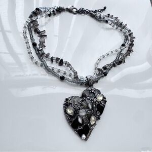 Chico's multi-strand necklace featuring a large heart-shaped pendant